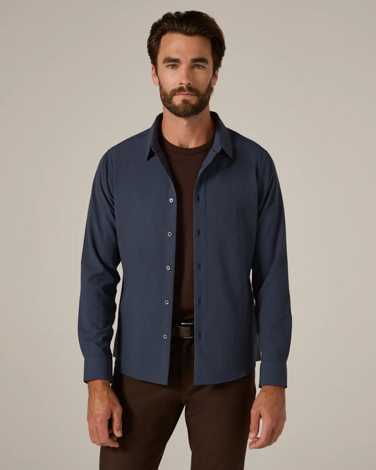 The Drayton Long Sleeve Shirt features an eco-friendly Modal blend that’s cool, breathable, and soft. Its seersucker-inspired texture promotes airflow to keep you comfortable all day. Finished with grosgrain tape and a signature locker loop, this tailored-fit shirt works perfectly under a blazer or on its own.