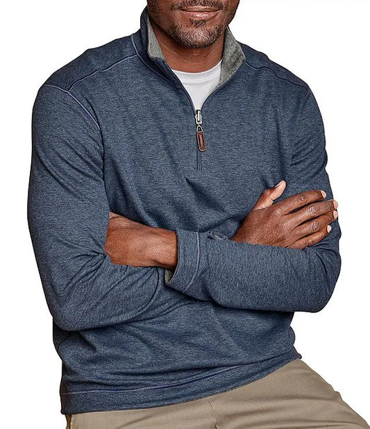 This quarter-zip features a lightweight, cottony blend with a textured piqué front and smooth jersey back. It has a stand collar, tonal embroidered logo at the neck, and a leather-look zipper pull. Comfortable and easy to care for with machine wash convenience.