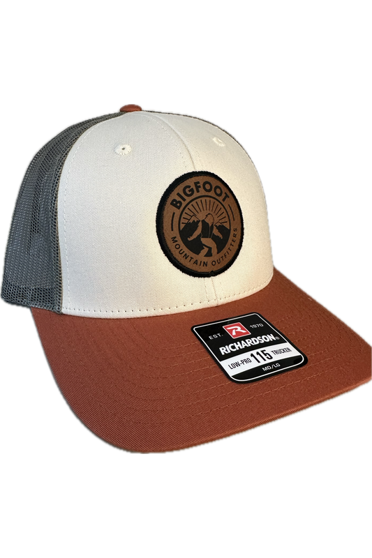 Bigfoot Mountain Outfitters signature mesh hat in Loden/Dark Orange, a classic trucker hat for hunting season, fishing, hiking and everyday wear