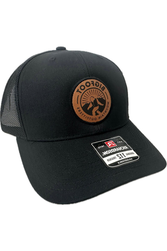 Bigfoot Mountain Outfitters signature mesh hat in Black/Black, a classic trucker hat for fishing, hiking, road trips, game days and everyday wear