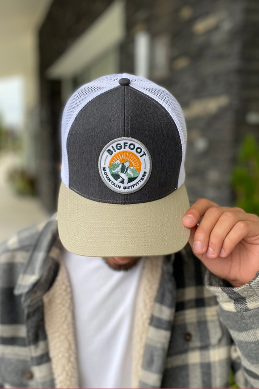 Bigfoot Mountain Outfitters original patch logo mesh back hat in Charcoal/Tan/White, a casual classic trucker hat for sunny days on the water, road trips, festivals and everyday wear