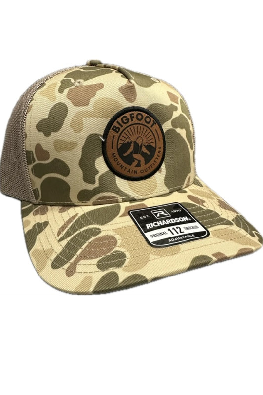 Bigfoot Mountain Outfitters signature mesh hat in Harvest Duck Camo/Tan, a classic trucker hat for duck hunts, fishing trips, yard work and everyday outdoor adventures