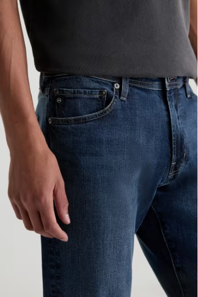 AG Graduate tailored-leg jean in Sequel, a comfortable, polished denim staple that dresses up for the office and dinner or down for weekends