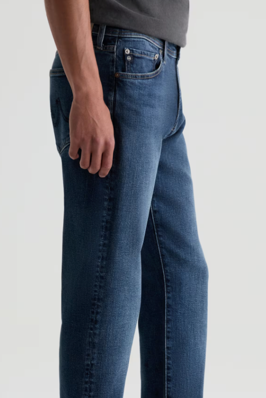 AG Graduate tailored-leg jean in Sequel, a comfortable, polished denim staple that dresses up for the office and dinner or down for weekends