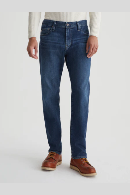 AG Graduate tailored-leg jean in Midlands, a comfortable, polished denim staple that dresses up for the office and dinner or down for weekends