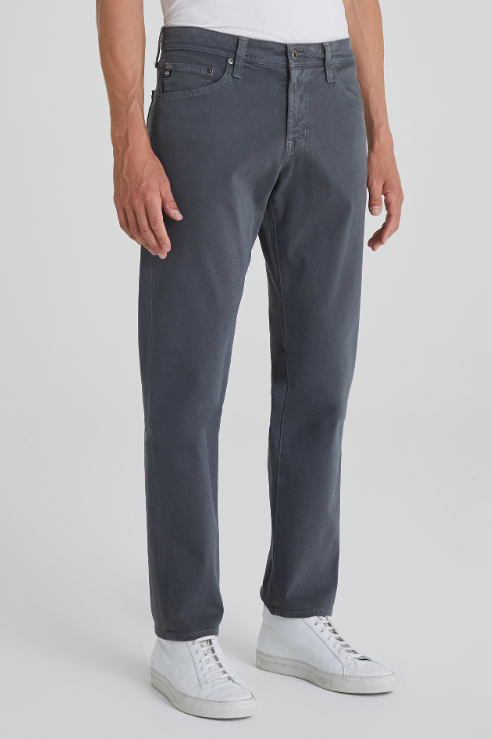 AG Graduate tailored-leg jean in Folkstone Grey, 32 inch inseam, a comfortable grey denim staple that dresses up for the office or down for weekends